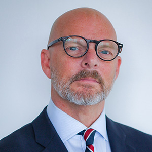 A headshot of Colin Scott.