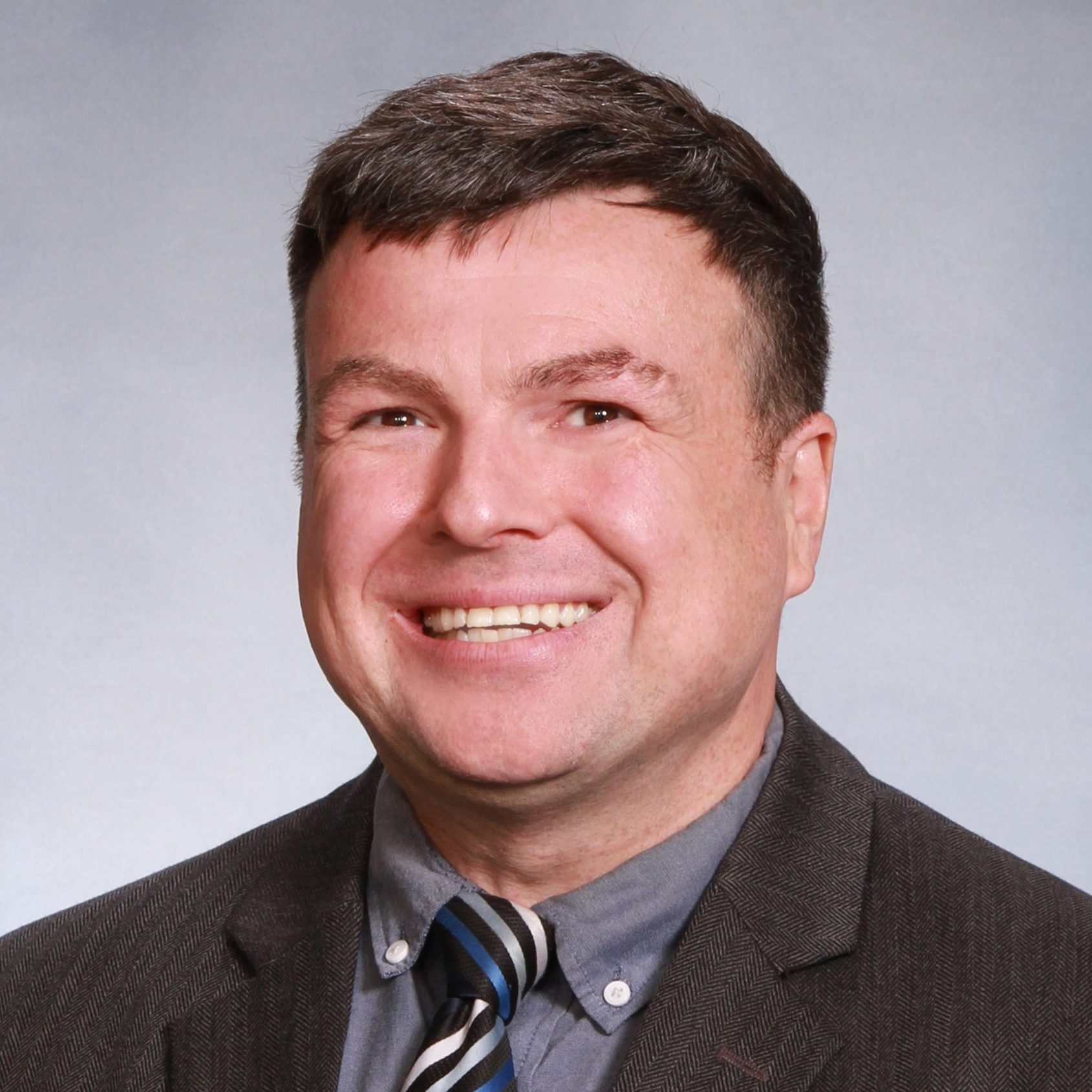 A headshot of Justin McKenna.