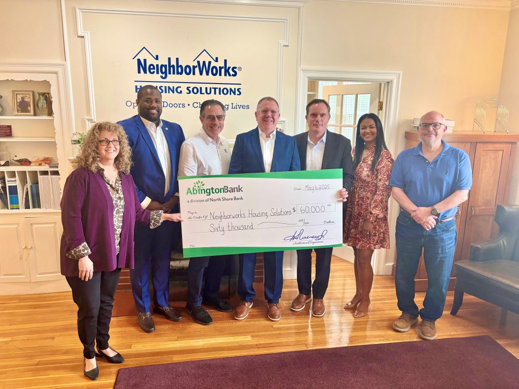 A check presentation for Neighborhood Works Housing Solution.