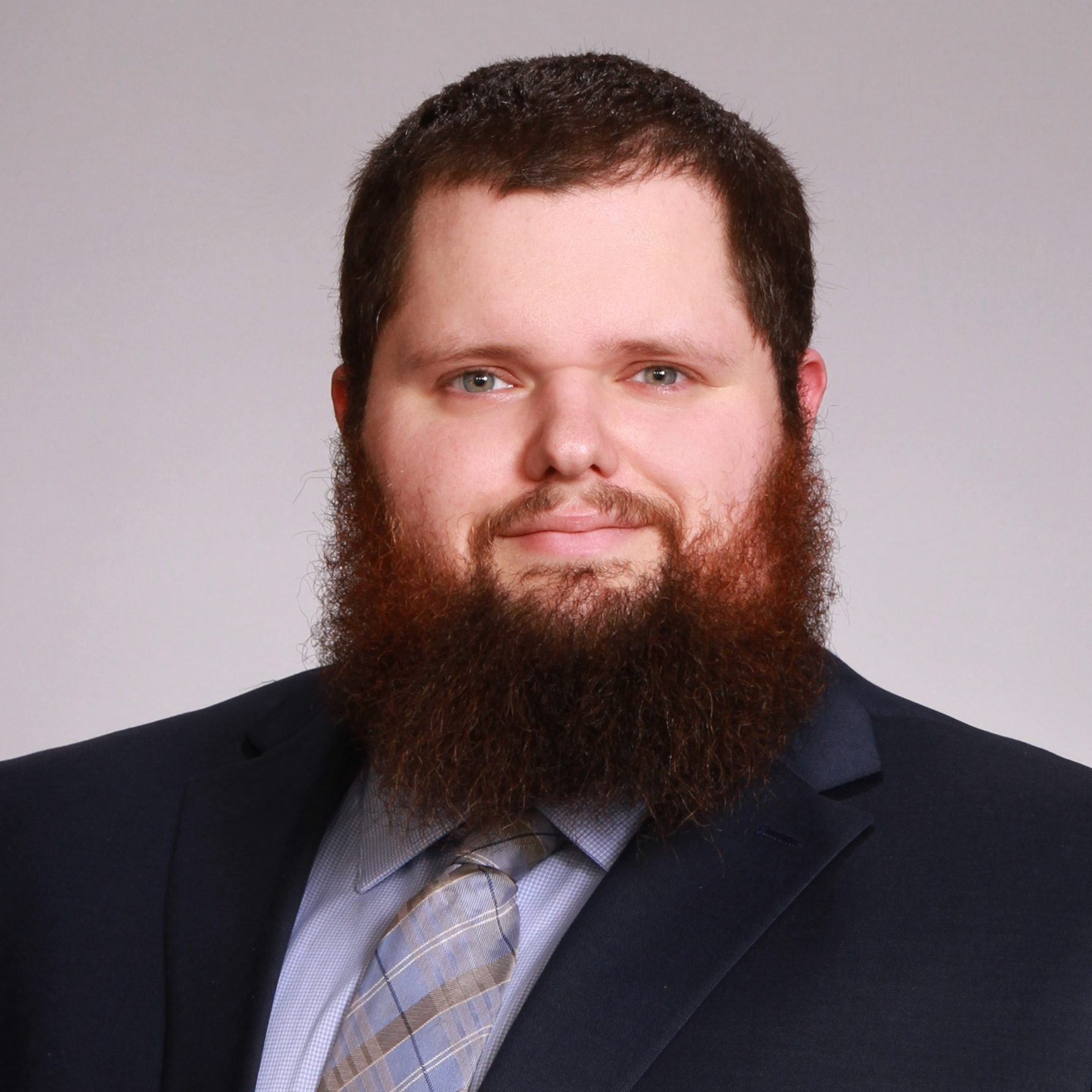 A headshot of Justin Deprisco.