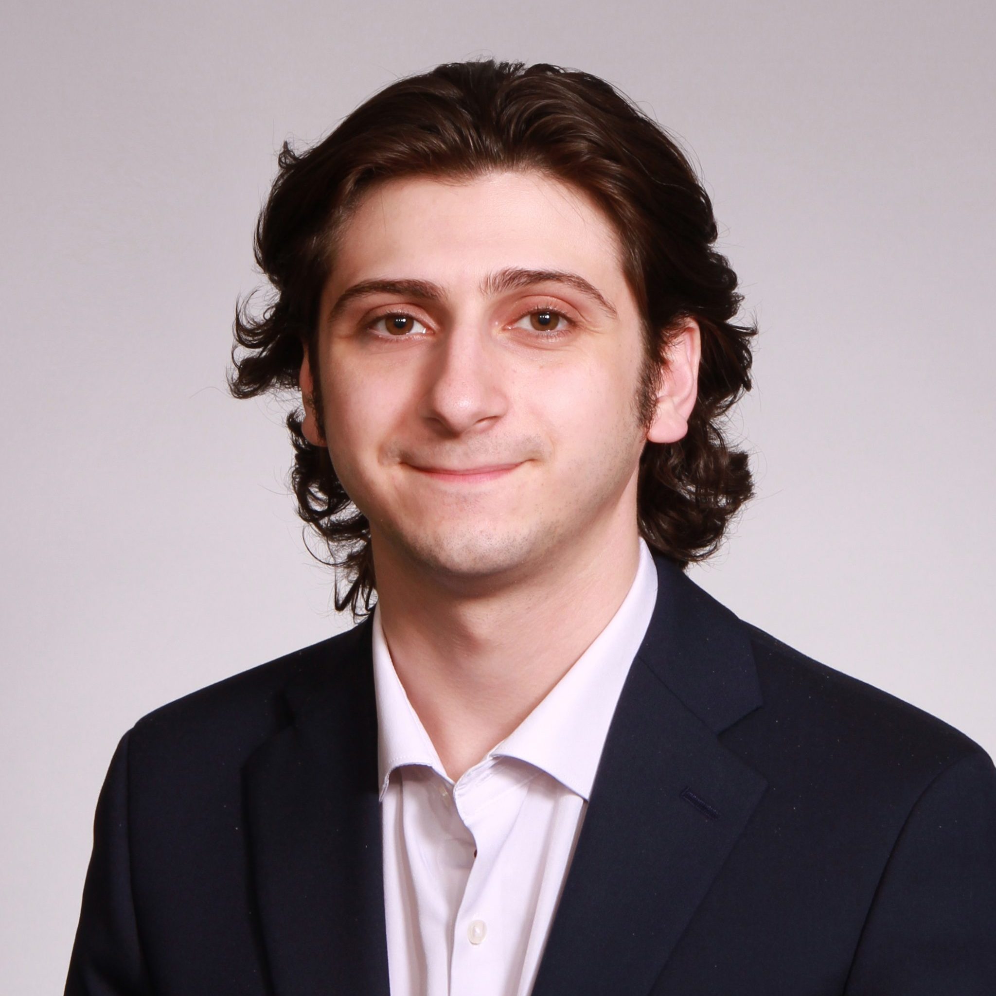 A headshot of Marco Maglio.