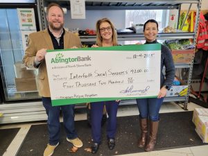 A check donation to Interfaith Social Services from our charitable giving program, The Giving Tree.