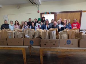 A check donation to Saugus United Food Pantry from our charitable giving program, The Giving Tree.