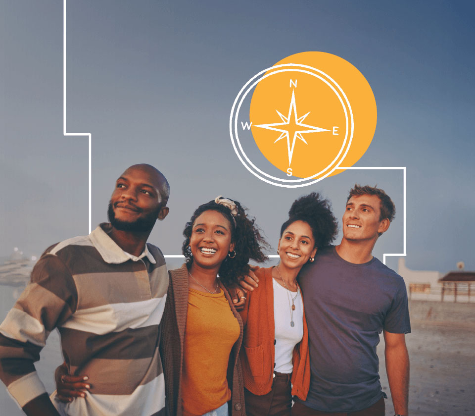 Four smiling people at the beach looking at the sun