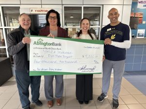 A check donation to the YMCA Southcoast Full Plate Project from our charitable giving program, The Giving Tree.