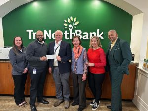 A check donation to Beverly Education Foundation from from our charitable giving program, The Giving Tree. 