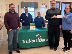 A check donation to Danvers Education Enrichment Program from from our charitable giving program, The Giving Tree. 