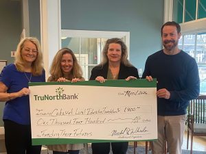 A check donation to Cohasset Education Foundation from our charitable giving program, The Giving Tree.