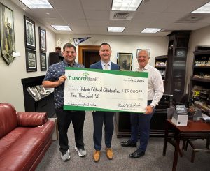 A check presentation to the Peabody International Festival