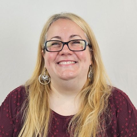 A headshot of Katie Woods.