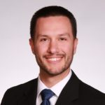 A headshot of Curtis Szcsechowicz.