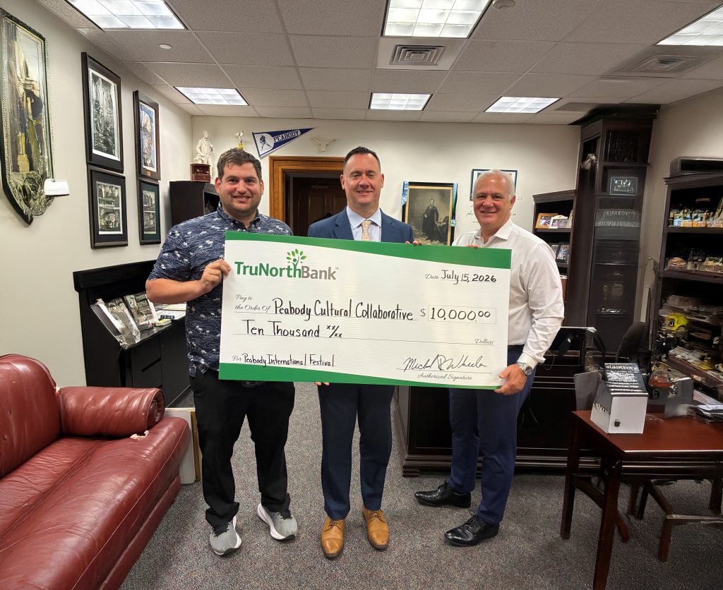 A check presentation of a $10,000 donation to the Peabody International Festival. 