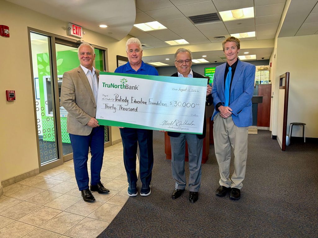 A check donation to the Peabody-Education-Foundation.