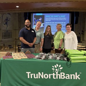 TruNorth Bank employees pose at the Cabot Theater.